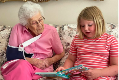 Sweet Girl Goes Door To Door At Retirement Village Reading Books To The Elderly