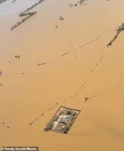A Family Constructs Their Own Levees Around Their Home To Save It From Flooding