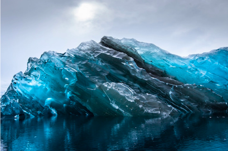 Breathtaking Photos Of a Rare Iceberg Which Flipped Upside Down 1