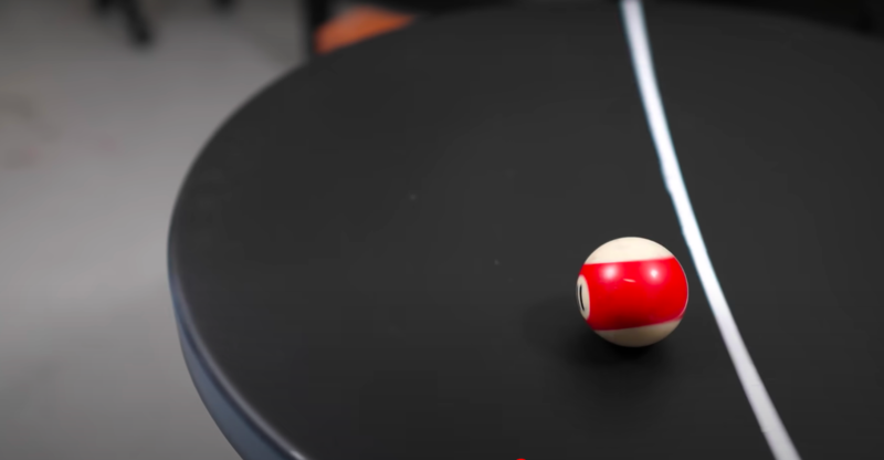 Scientific Reason Why a Solid Ball Will Not Fall Off a Spinning Table 1