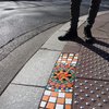 Street Artist Puts Creativity To Work As He Transforms Cracks in Pavement Into Gorgeous Mosaics