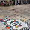 Street Artist Puts Creativity To Work As He Transforms Cracks in Pavement Into Gorgeous Mosaics